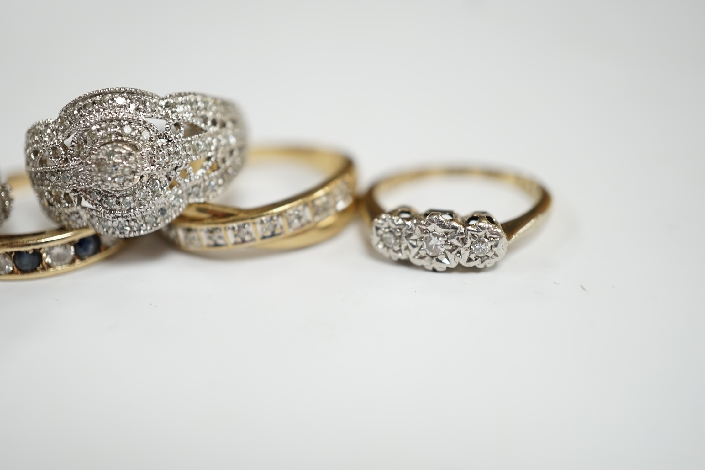 Five assorted modern 9ct and gem set rings including diamond chip cluster and sapphire and diamond chip, gross weight 12.7 grams, together with a 925 and diamond chip cluster set ring.